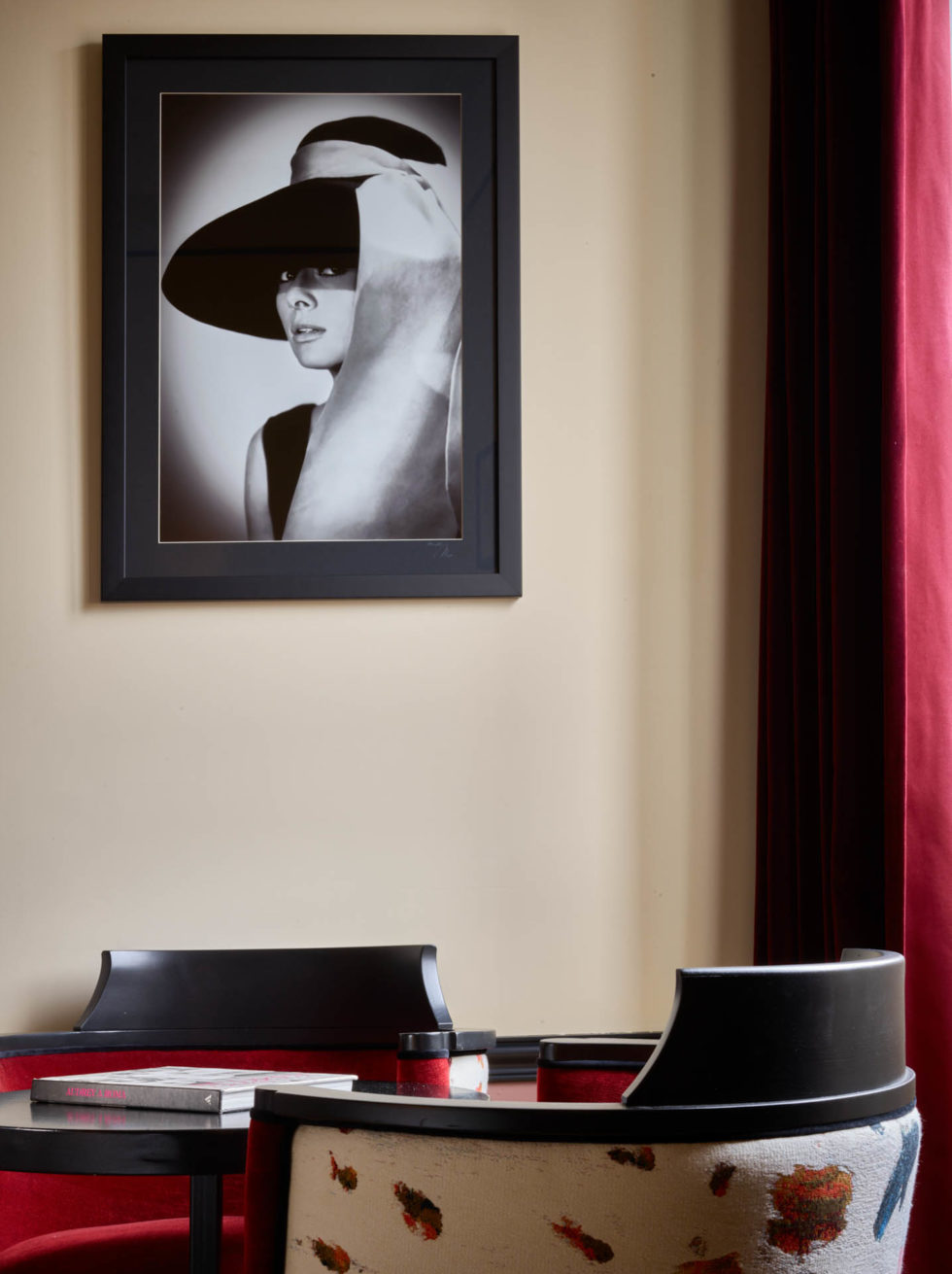 Detail of 1960s-themed room at 47 Boutique Hotel with black and white Audrey Hepburn photo, relaxing corner