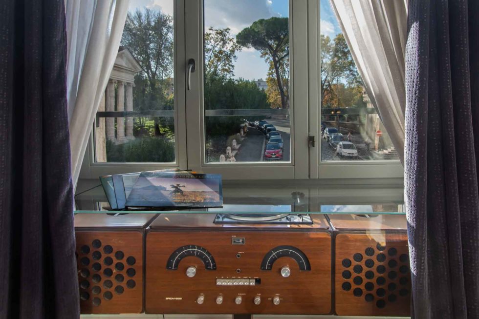 Historic RR126 radio by Castiglioni brothers at 47 Boutique Hotel, Italian design floor, window view of the Forum Boarium temples
